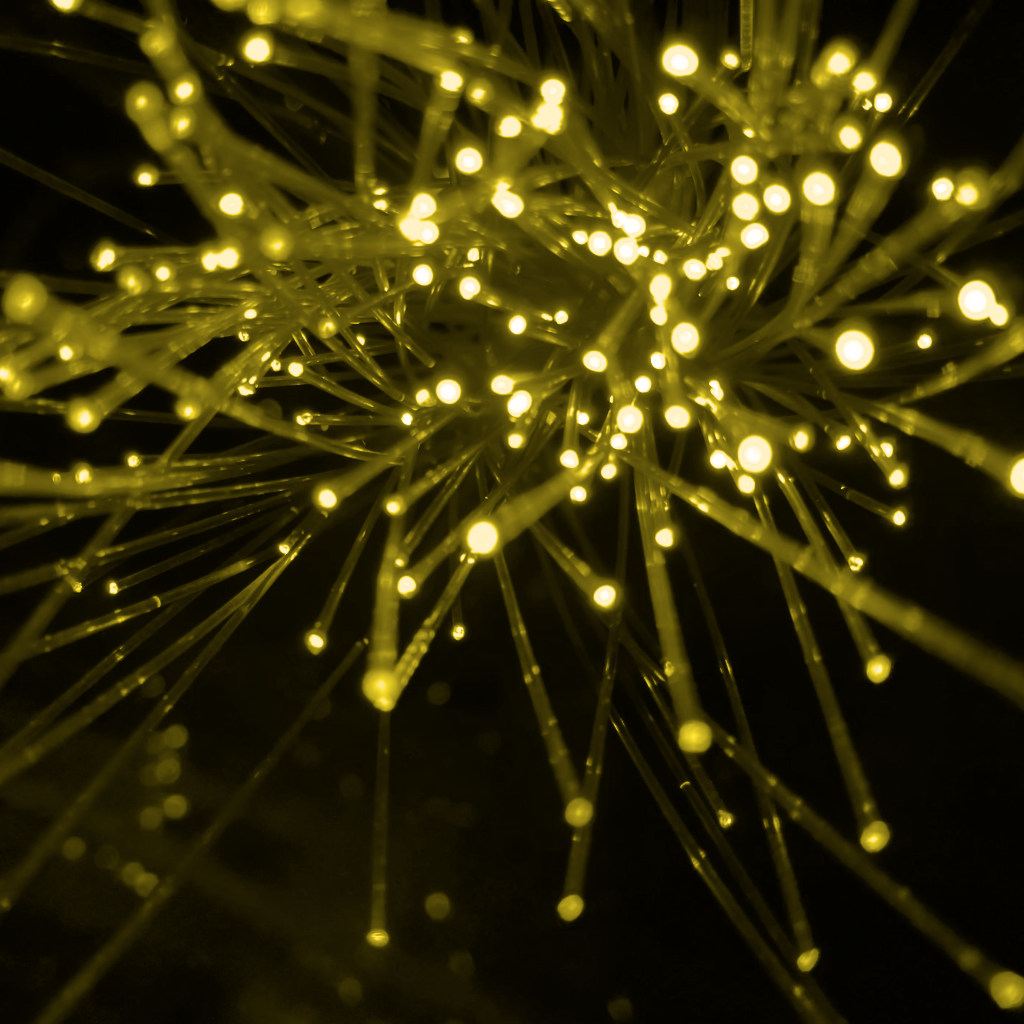 A bundle of golden fiber optic cables